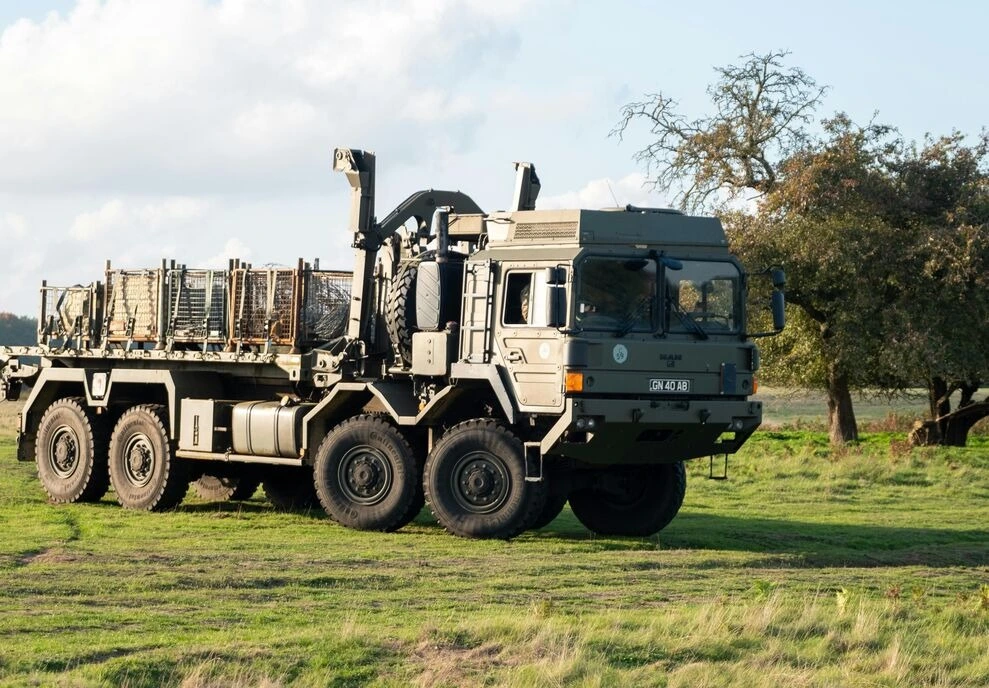 military-grade ground vehicle moving through the field